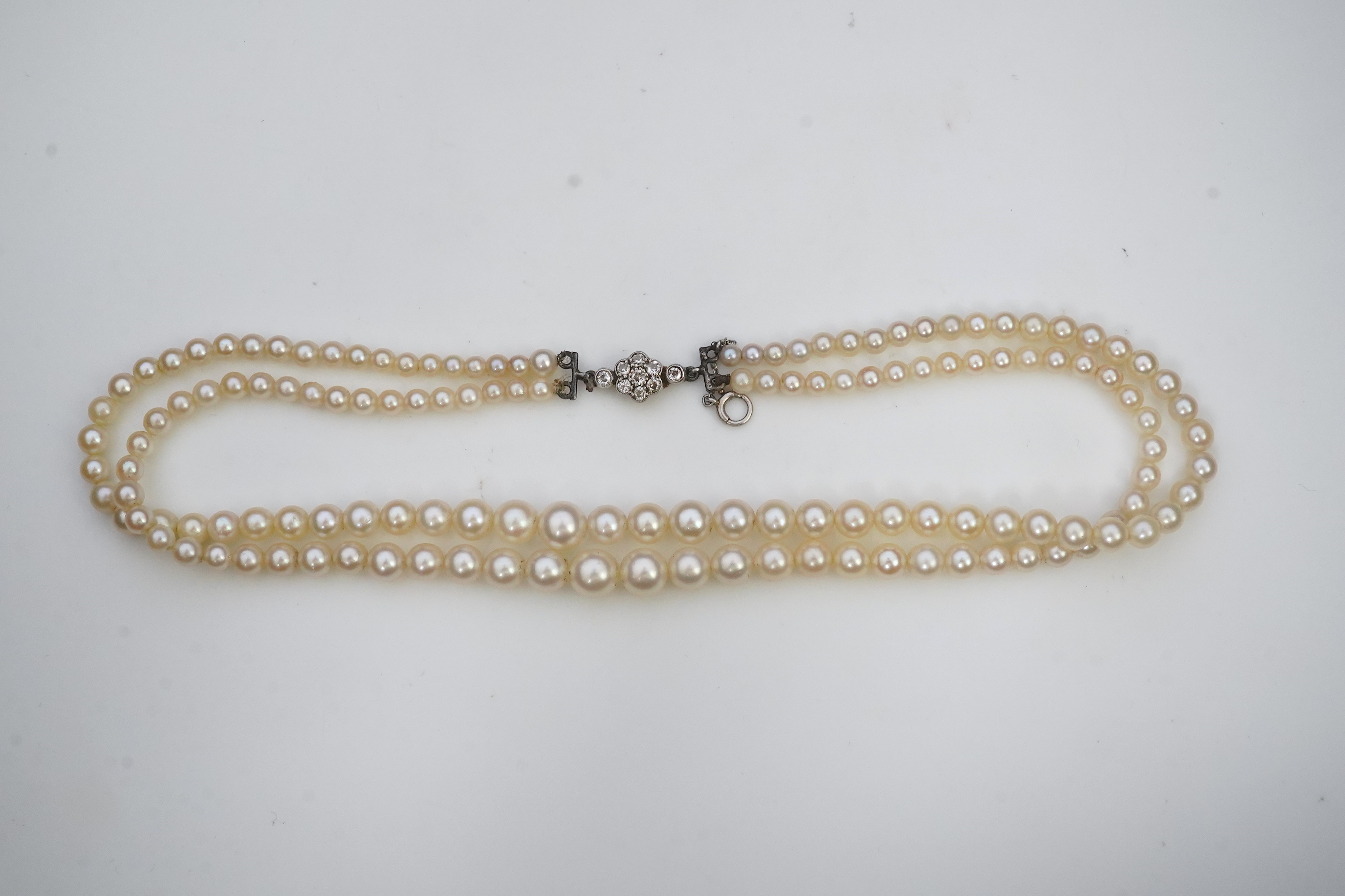 A cultured pearl and diamond necklace, early 20th century and later